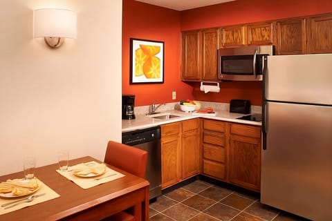 Cook with ease in a tidy kitchenette with modern essentials.