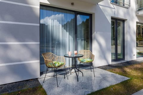 The terrace's stylish design complements the apartment's decor. 