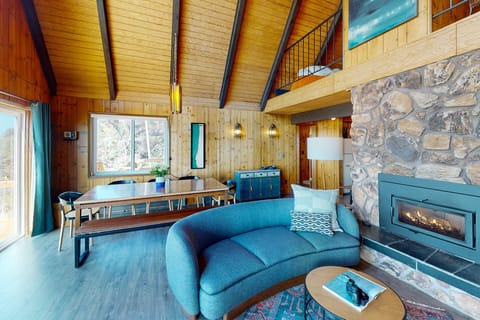 The open concept is perfect for gathering by the fire or at the large dining table.