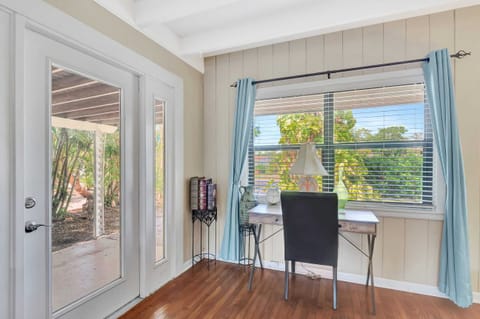 There is a Desk and Chair to Allow Guests to Stay Digitally Connected During Their Stay