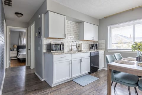 Whip Up Delicious Meals in Our Spacious Kitchen, Complete with Familiar Home Appliances: Full-Size Fridge and Stove (as shown later), Microwave, Coffee Maker, Toaster, and More.