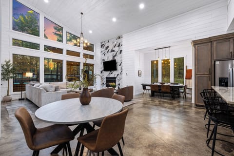 Gather, dine & connect in our inviting open-concept living & dining spaces. Choose from 3 stylish dining spots: a table for 7, a cozy round table for 4, & a chic spacious bar island seating 3—all designed for connection.