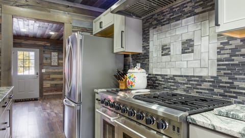 A large stainless steel refrigerator with an ice maker is a high-end appliance that can provide all the necessary features for a gourmet kitchen. It adds a touch of luxury and practicality to the kitchen.