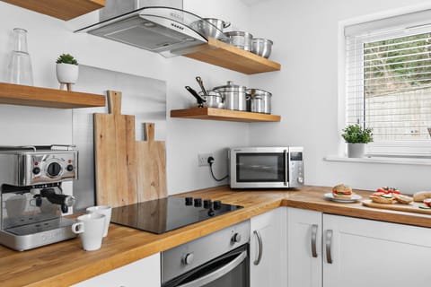 Electric hob and oven with microwave with pots and pans for cooking in the property - Plover 1, The Cove