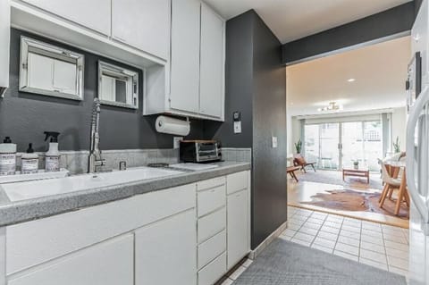 Kitchen with new stove, refrigerator and dishwasher.
