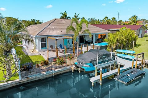 Enjoy a stunning exterior view of the home with direct access to the peaceful canal river, perfect for waterfront relaxation.