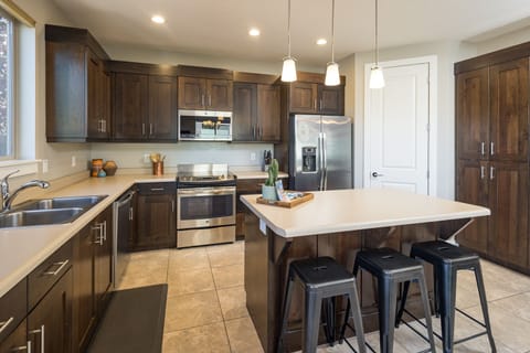 Kitchen Area with Appliances & Island in the middle