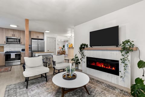 Living room looking into the open kitchen.