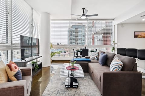Bright And Cozy Living Room With Smart TV For Your Entertainment
