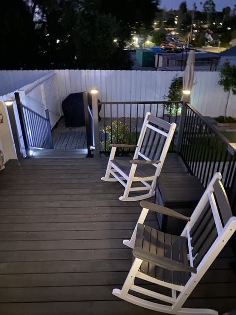 Outside deck at night, with two rocking chairs to enjoy the stars