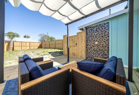 Spacious Backyard with Outdoor Shower and Plush Seating