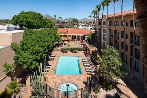 Dive into sunshine beside the sparkling pool and spa.