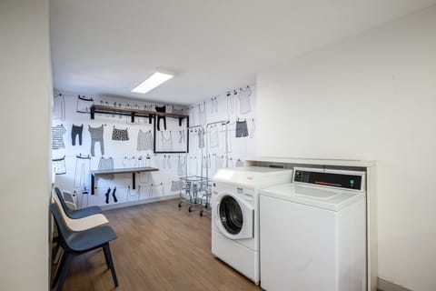 Fold and organize comfortably in a clean, airy laundry room.
