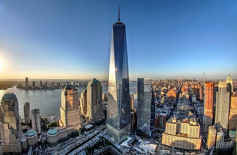 Marvel at iconic city towers and glittering harbor from above.