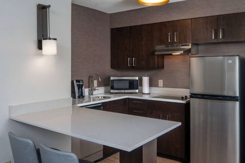 Cook comfortably with modern appliances and generous counter space.