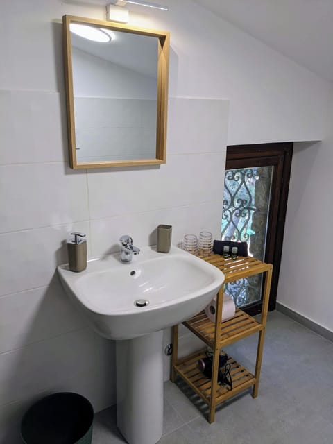 All bathrooms contain a toilet, bidet, sink, heated towel bar, and shower.