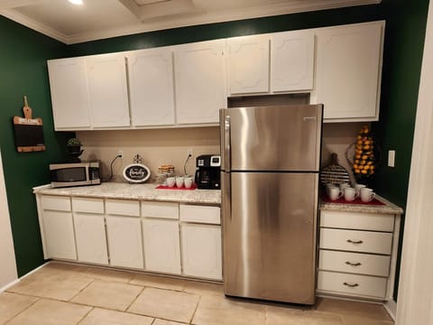 Kitchen with microwave, coffee station and added airfryer and wine station.