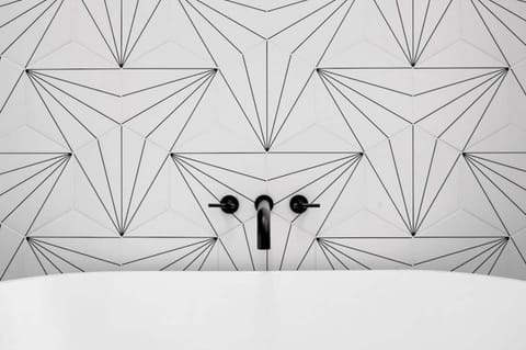 Stunning custom tile work in both bathrooms make you feel like a rockstar!