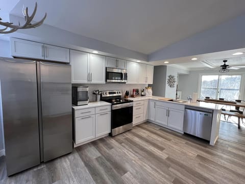 Side by side refrigerator, glass top 5-burner stove, oven, microwave, dishwasher