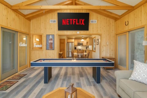 Sunlit den with 65 inch tv for your entertainment