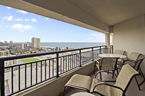 Breathe in the ocean air on your private balcony with stunning sea views and city skyline.