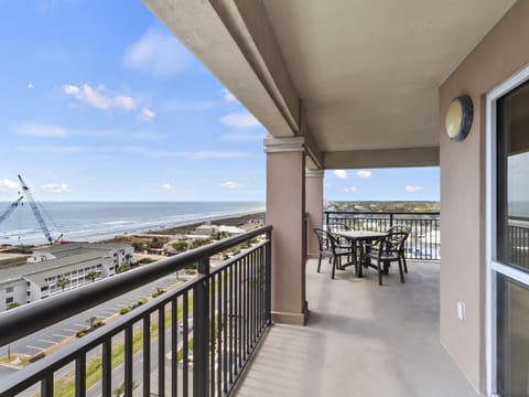 Your private balcony offers stunning ocean views with comfortable seating to enjoy morning coffee or evening sunsets over the coastline.