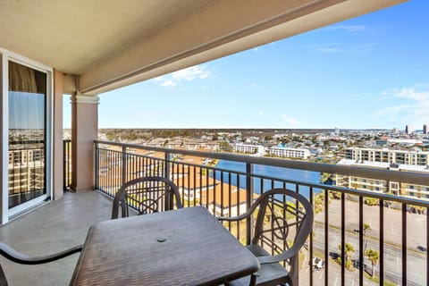 Enjoy your morning coffee or evening drinks on this private balcony with panoramic city views stretching to the horizon.