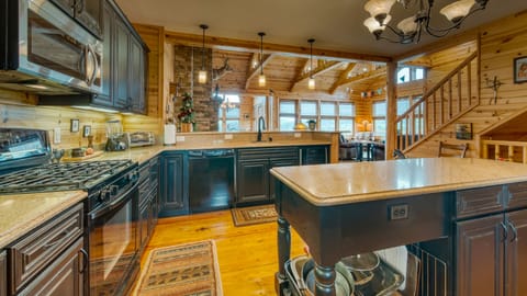 Spacious kitchen with bar stool seating.