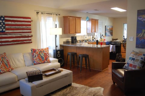 Open concept living room, kitchen, dining room, floorplan.