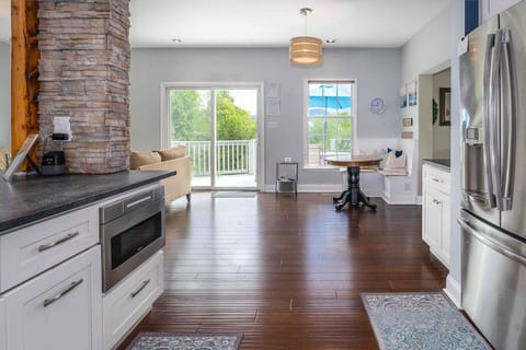 Open concept Kitchen with adjacent coffee bar and breakfast nook