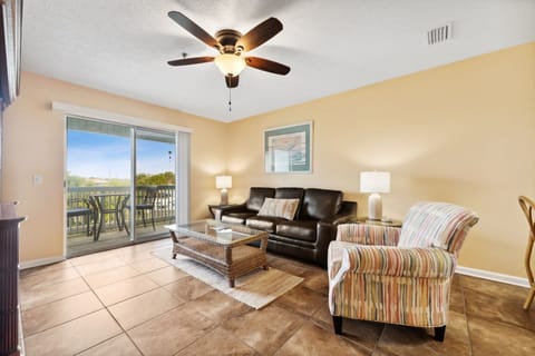 Spacious living room with a sofa and accent chair.