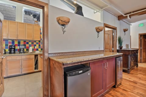 Your stylish kitchen features warm wood cabinets, granite countertops, and stainless steel appliances—perfect for preparing meals during your stay.