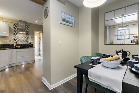 Enjoy meals together in the beautifully decorated dining area with table for 6 guests.