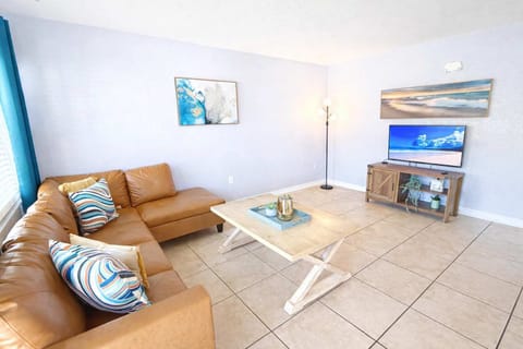 Inviting living room with plenty of space for family movie nights and conversations.