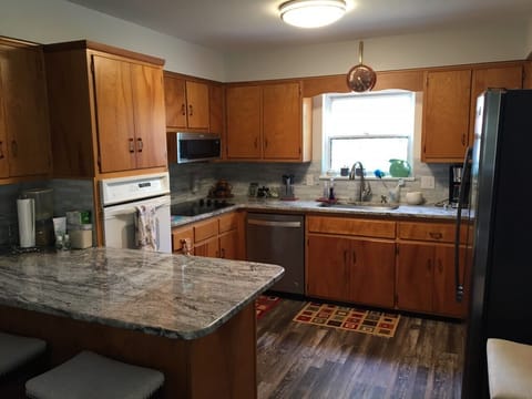 Large kitchen with plenty of appliances to include air fryer.