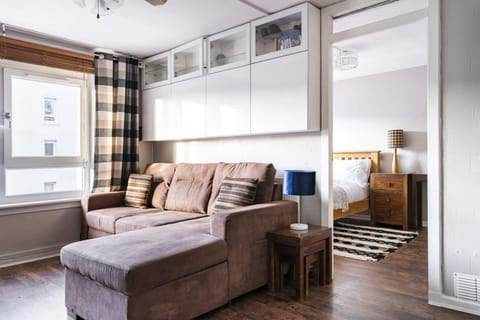 Living room area looking into the bedroom area