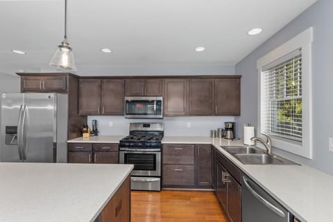 Fully Stocked Kitchen With Stainless Steel Appliances