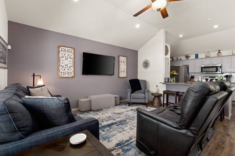 Spacious living room has three La-Z-Boy recliners and a queen size sleeper sofa with a memory foam mattress.