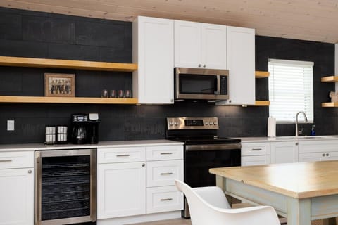 From wine fridge to coffee station, this kitchen has everything for morning pick-me-ups or evening wind-downs.