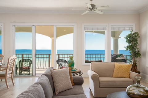 Relax in your bright, coastal living room where ocean breezes flow through glass doors to your private balcony.