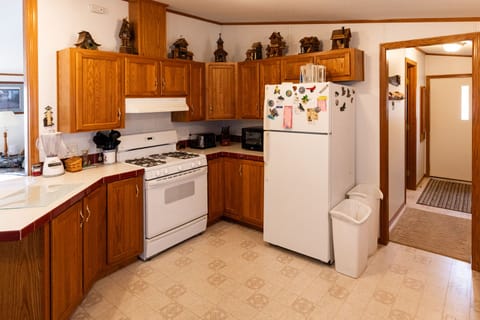 Gas stove, microwave, blender, and toaster.