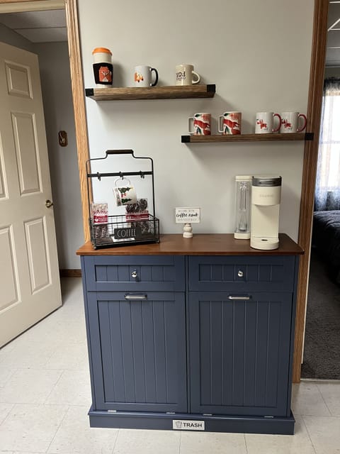 Coffee/tea/hot chocolate bar with recycle bin underneath 