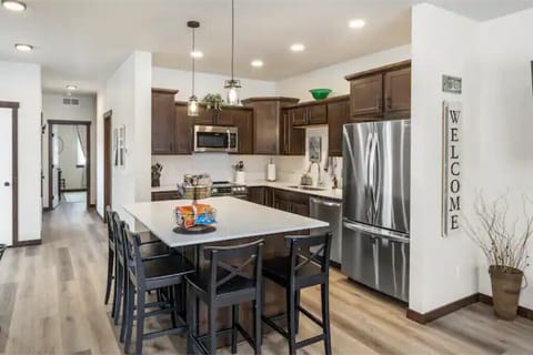 Kitchen w/brand new appliances & quartz counter. Very well stocked with cookware