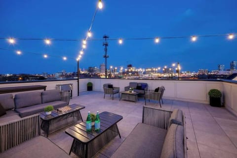 Savor starlit evenings under a canopy of glowing string lights on our stunning rooftop deck.
