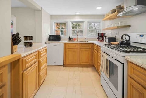 Bright and spacious, this kitchen offers plenty of room to prep, cook, and gather.
