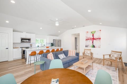 Kitchen large island with seating for 6, and seating for 4 at the back corner, plus seating for 4-10 outside on the patio. Kitchen comes stocked with everything you  need to make a basic meal.