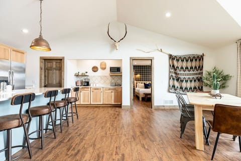 Plenty of room in the kitchen and dining area for everyone to enjoy a nice meal together.