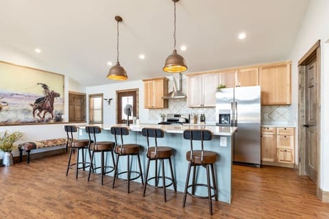 Large island and open concept for the whole family to gather.