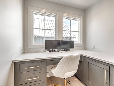 Workspace with dual monitors and a multi-port connector. Ultra fast wireless internet throughout the home