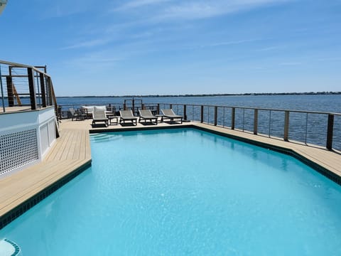 Large, deep, heated pool with water views in every direction